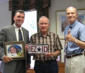 Senator_Brewer_holding_EZ-ID_License_Plate